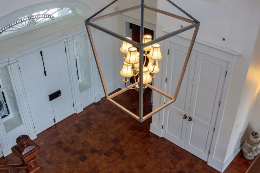 Luxury home: lobby chandelier with the Coolidge door