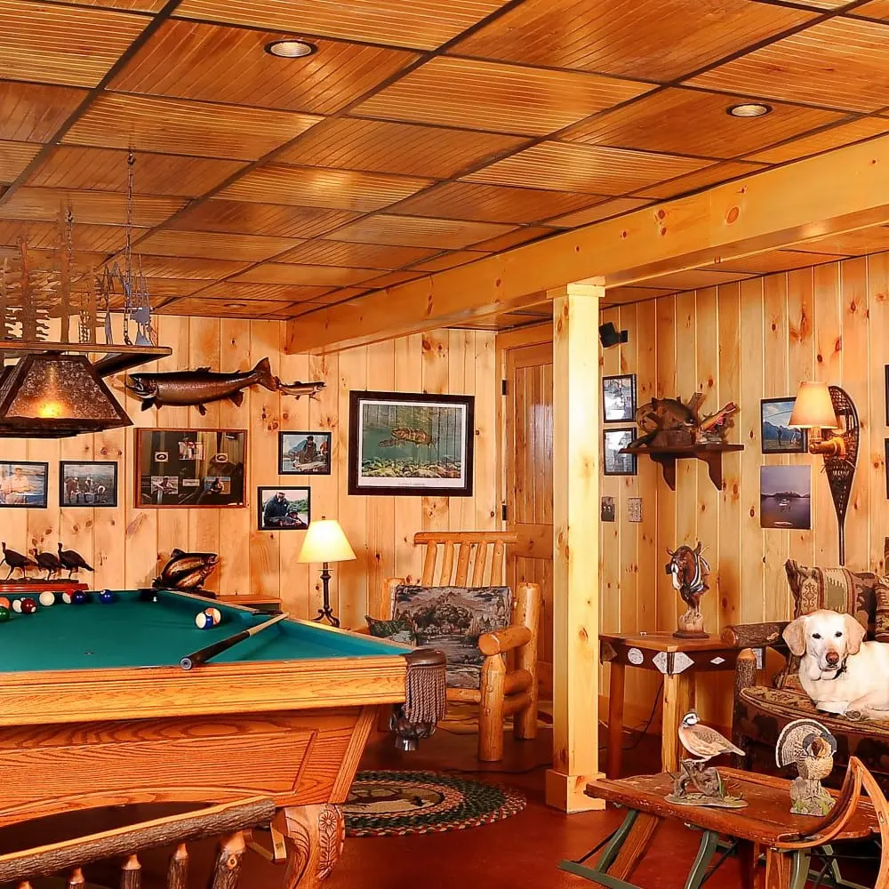 Renovated game room with pool table and knotty pine