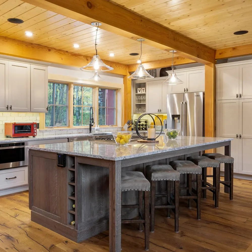 Renovated kitchen with island and wood beams