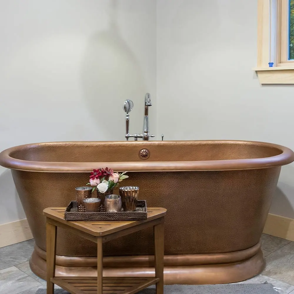 Copper soaking tub in a renovated bathroom